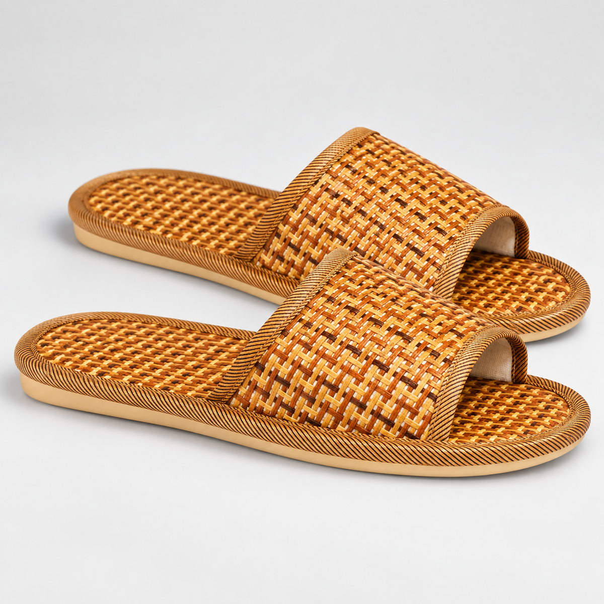 Side profile of woven bamboo-style open-toe slippers
